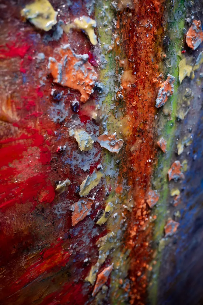 Close detail of a molten, metallic painted surface