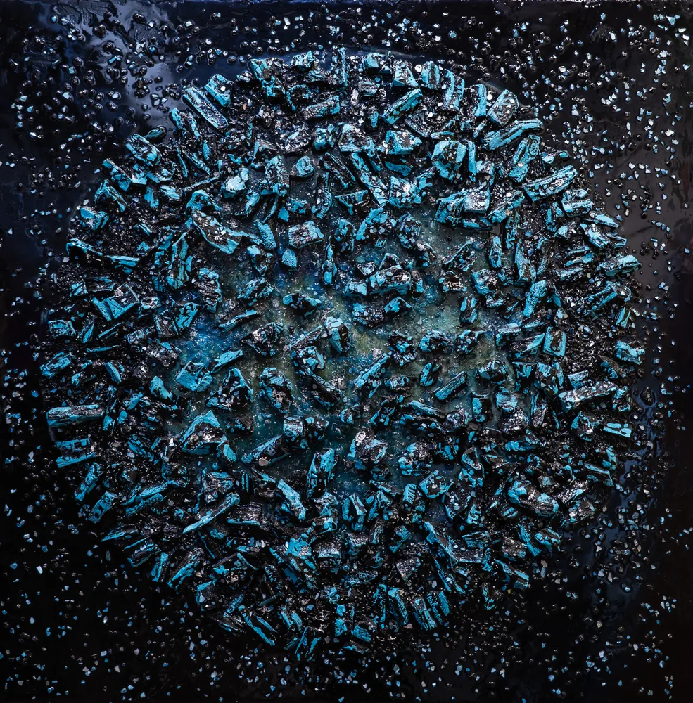 Close detail of an encrusted, jewel-toned textured surface